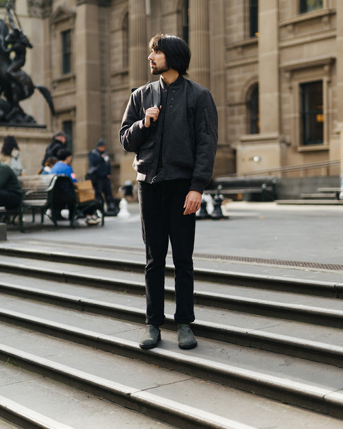 A man standing on steps outside a building.