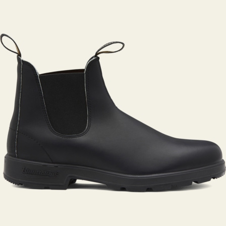 black chelsea boots on feet
